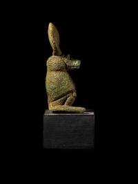 An Egyptian Bronze Baboon with a Sun Disc