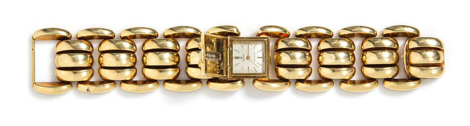 A Retro 18 Karat Yellow Gold and Diamond Surprise Wristwatch, 72.60 dwts.