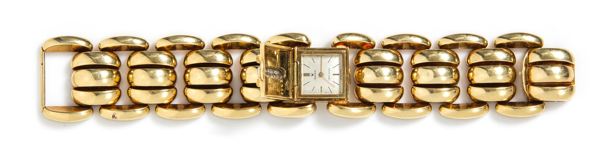 A Retro 18 Karat Yellow Gold and Diamond Surprise Wristwatch, 72.60 dwts.