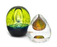 Kosta Boda, Sweden, two glass paperweights, each with internal air bubble decoration