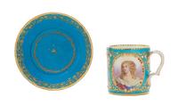 A Sevres Jeweled Porcelain Cup Height of cup 2 7/8 inches, diameter of saucer 5 1/8 inches.