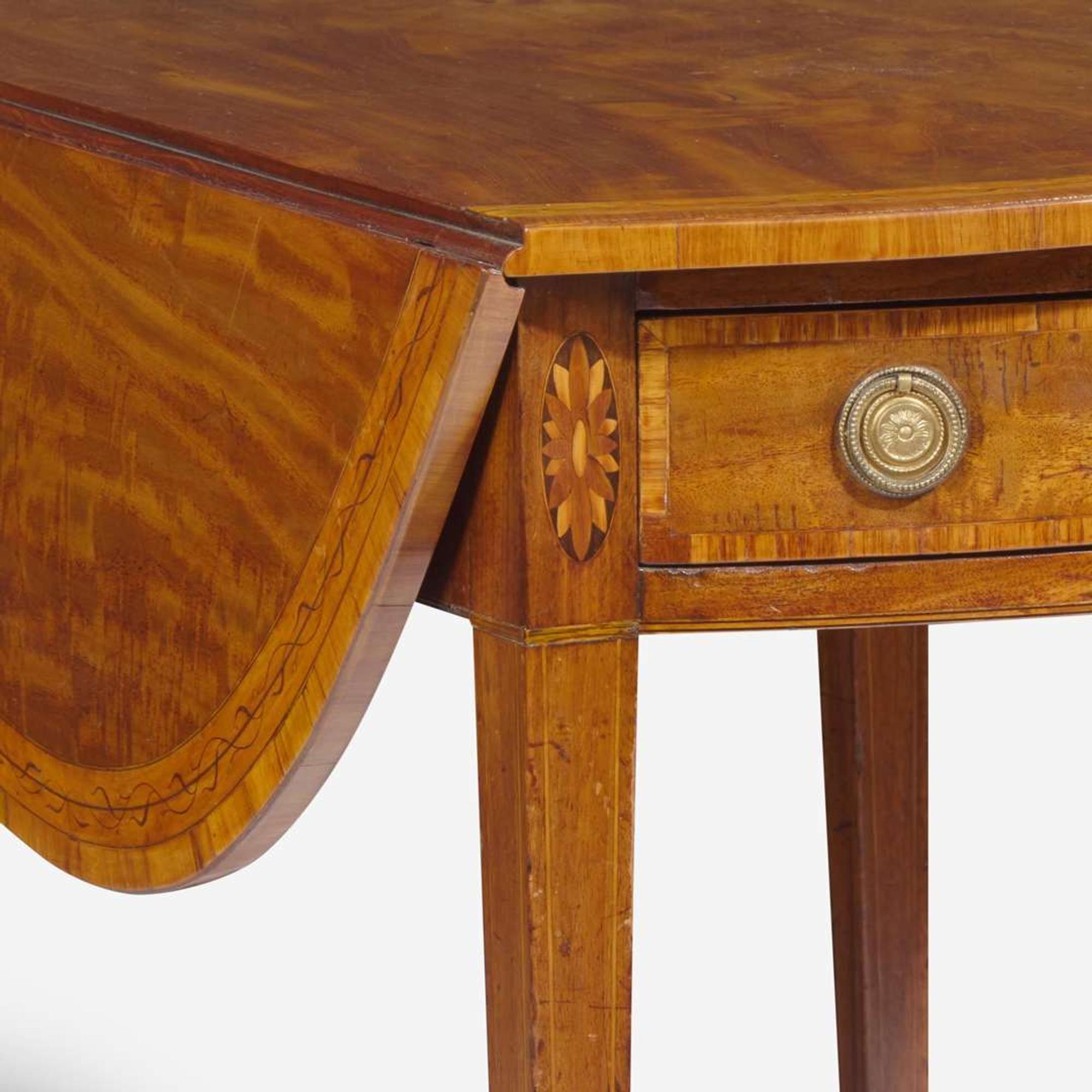 A George III oval inlaid mahogany and satinwood pembroke table circa 1780
