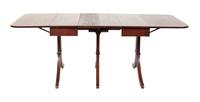 A Regency Style Mahogany Drop Leaf Dining Table Height 30 1/4 x width 83 1/4 x depth 39 3/4 inches.