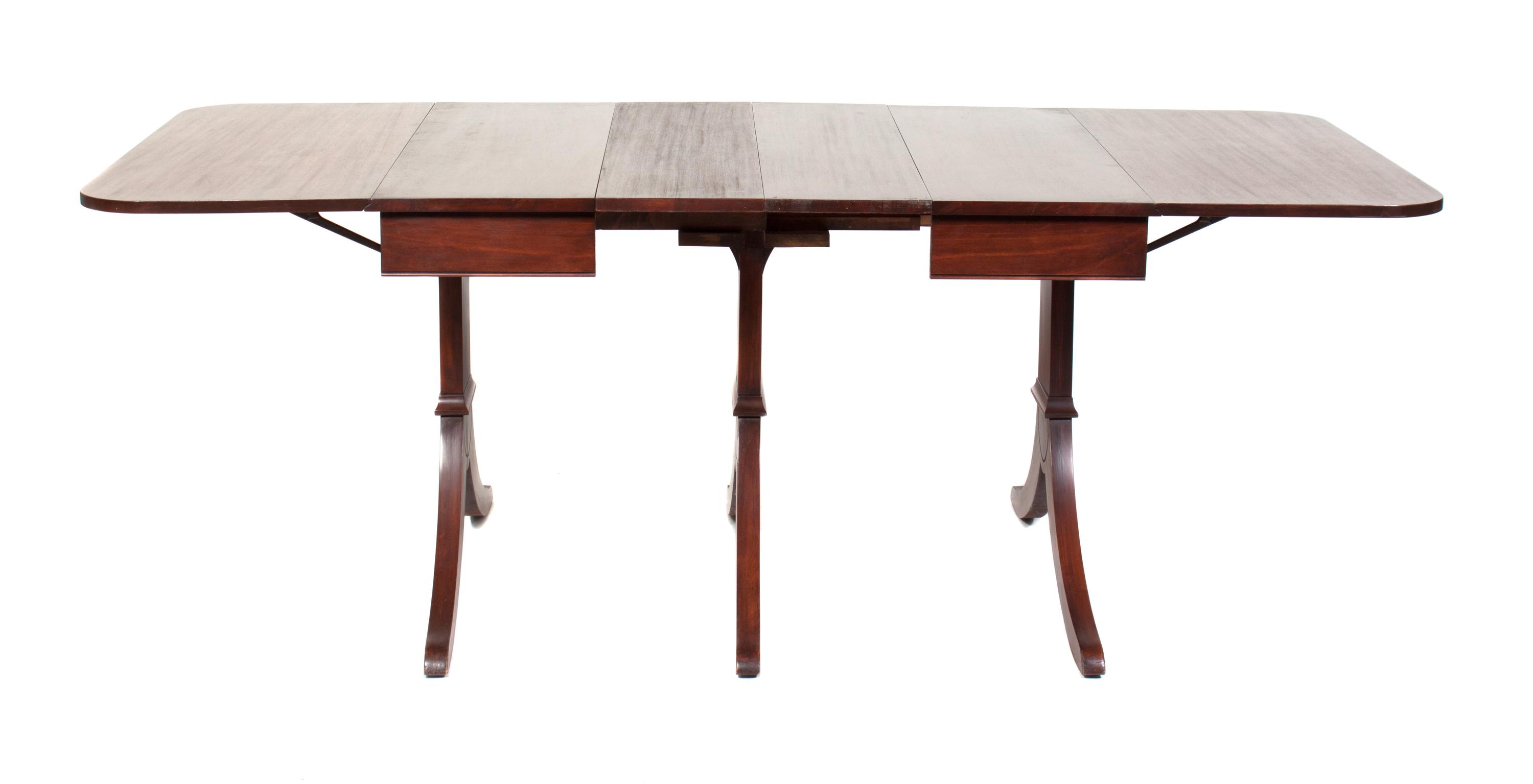 A Regency Style Mahogany Drop Leaf Dining Table Height 30 1/4 x width 83 1/4 x depth 39 3/4 inches.
