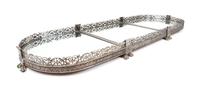 A Silvered Bronze Three-Piece Surtout de Table Height 3 5/8 x width 50 1/2 x depth 17 1/4 inches.
