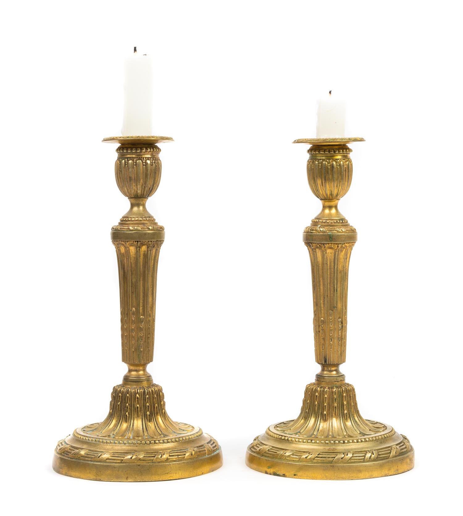 A Pair of Louis XVI Style Gilt Bronze Candlesticks Height 10 3/4 inches. — 19TH CENTURY