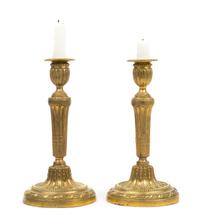 A Pair of Louis XVI Style Gilt Bronze Candlesticks Height 10 3/4 inches. — 19TH CENTURY