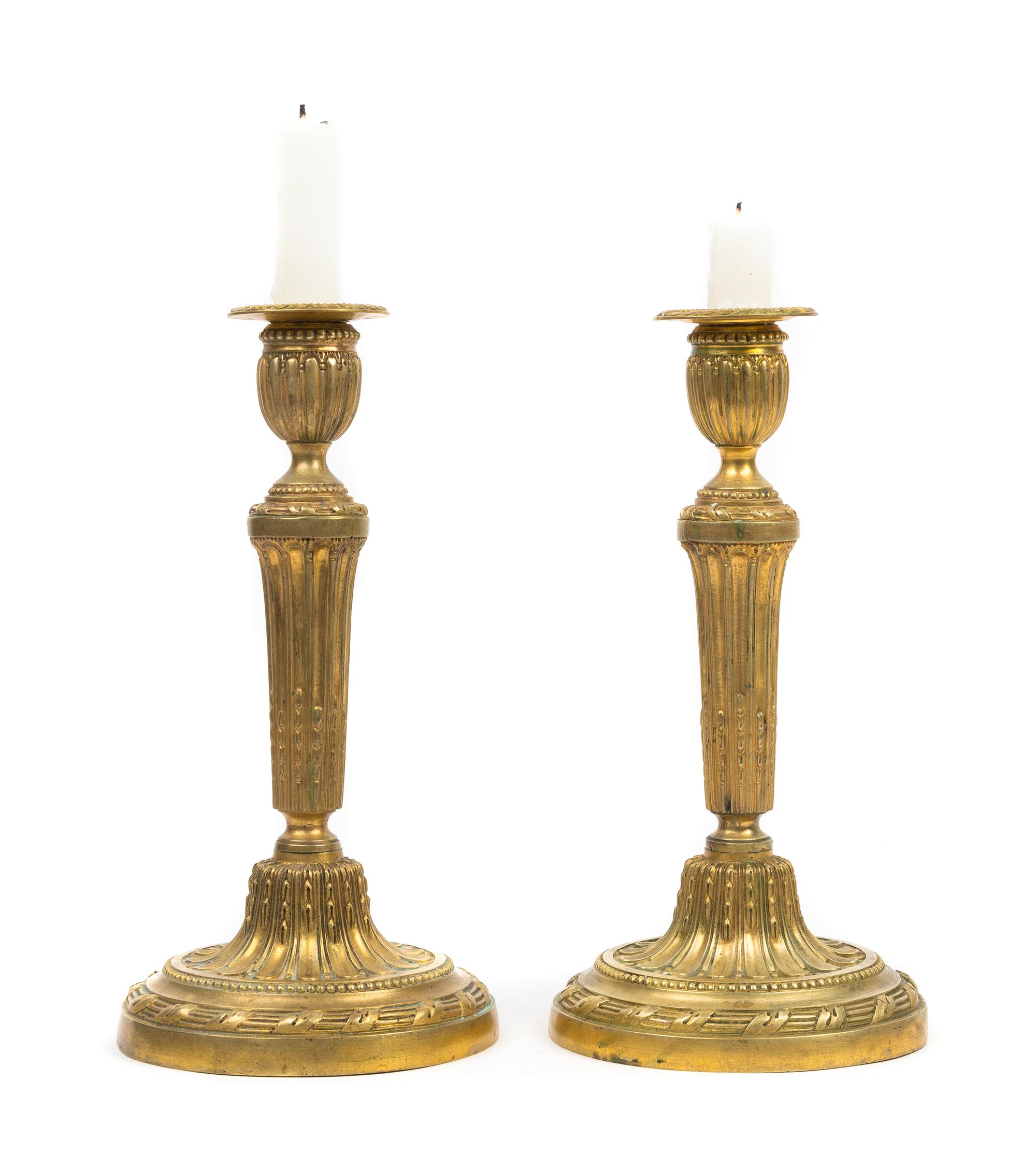 A Pair of Louis XVI Style Gilt Bronze Candlesticks Height 10 3/4 inches. — 19TH CENTURY
