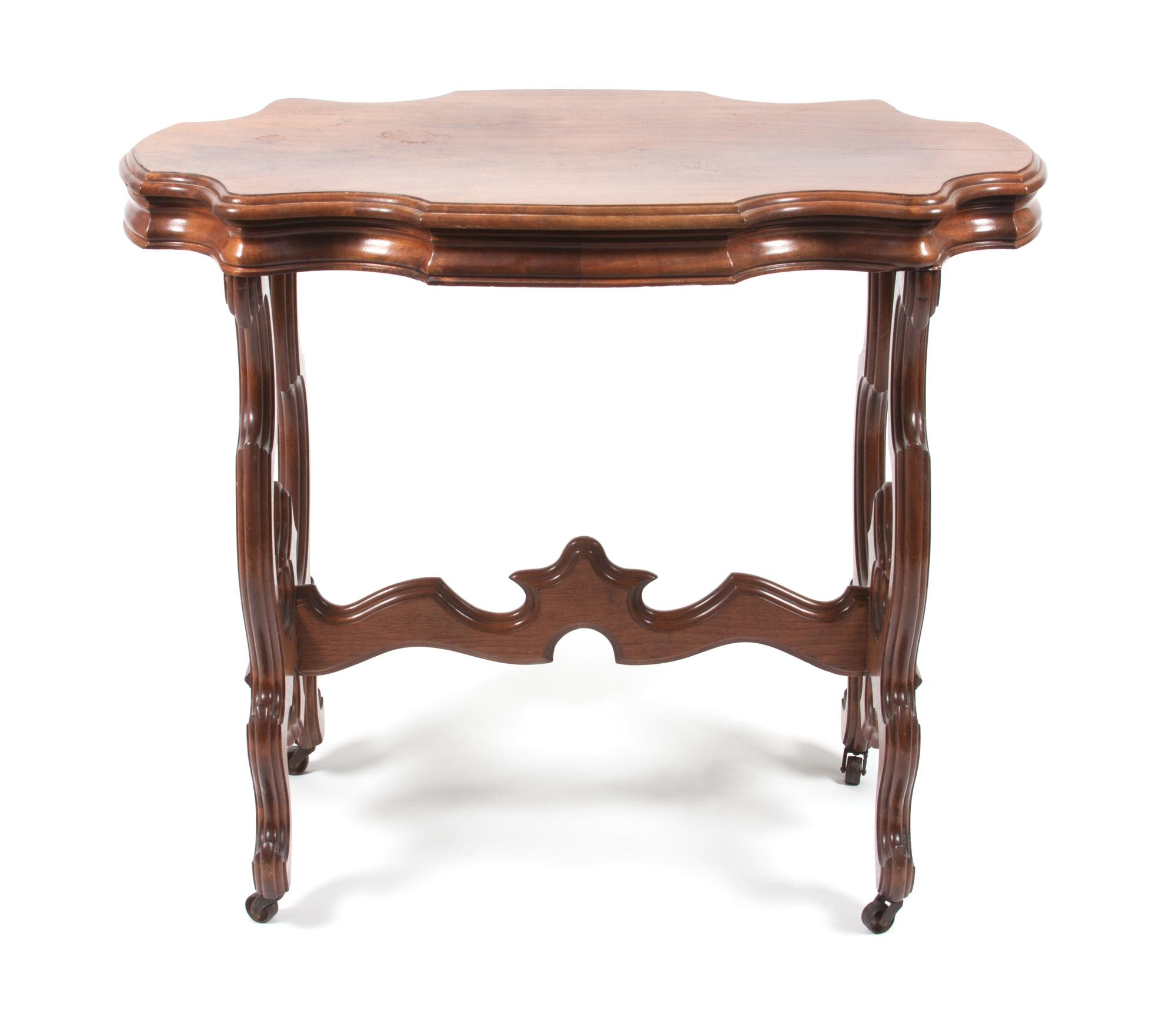 A Victorian Walnut Center Table Height 20 1/2 x width 26 x depth 22 1/2 inches. — 19TH/20TH CENTURY