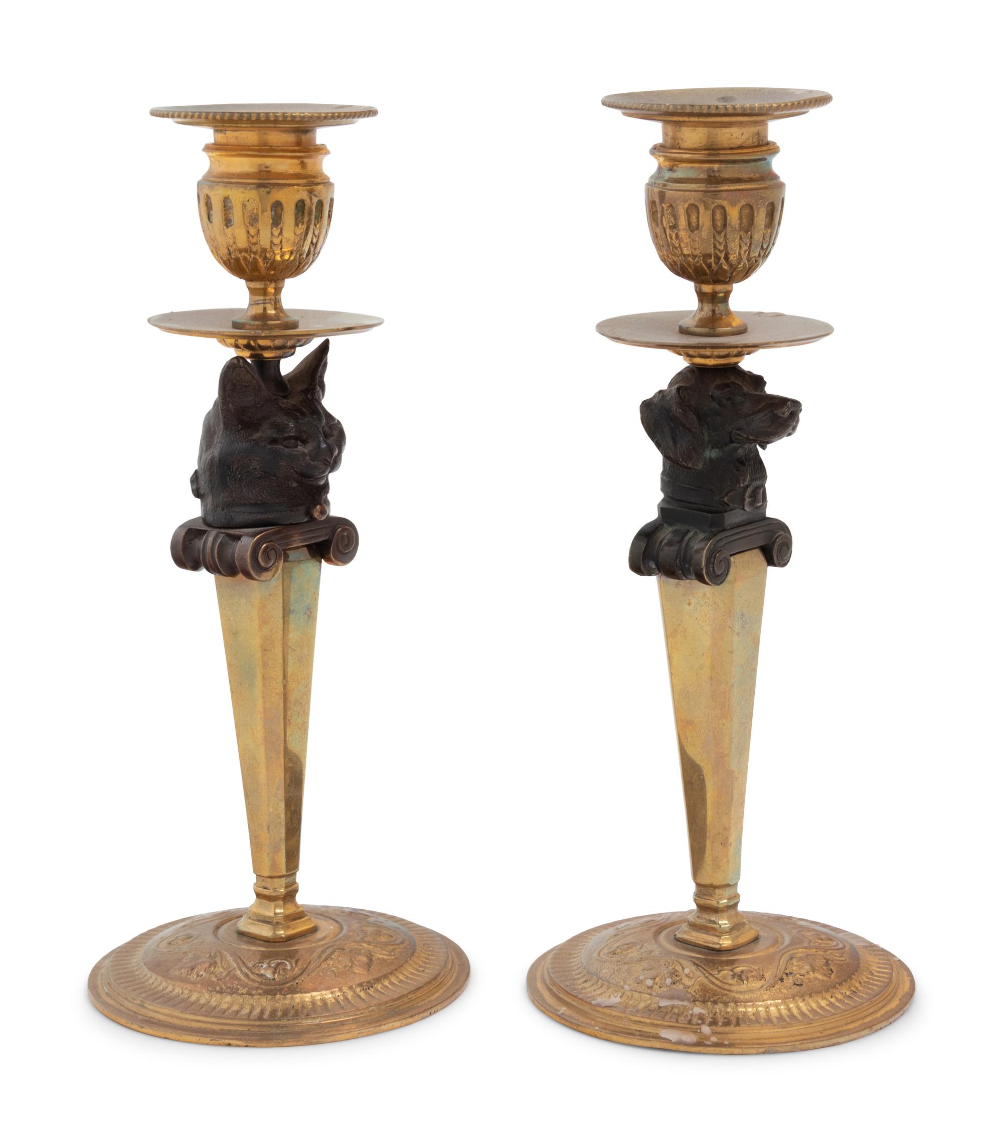 A Pair of Continental Gilt and Patinated Bronze Figural Candlesticks