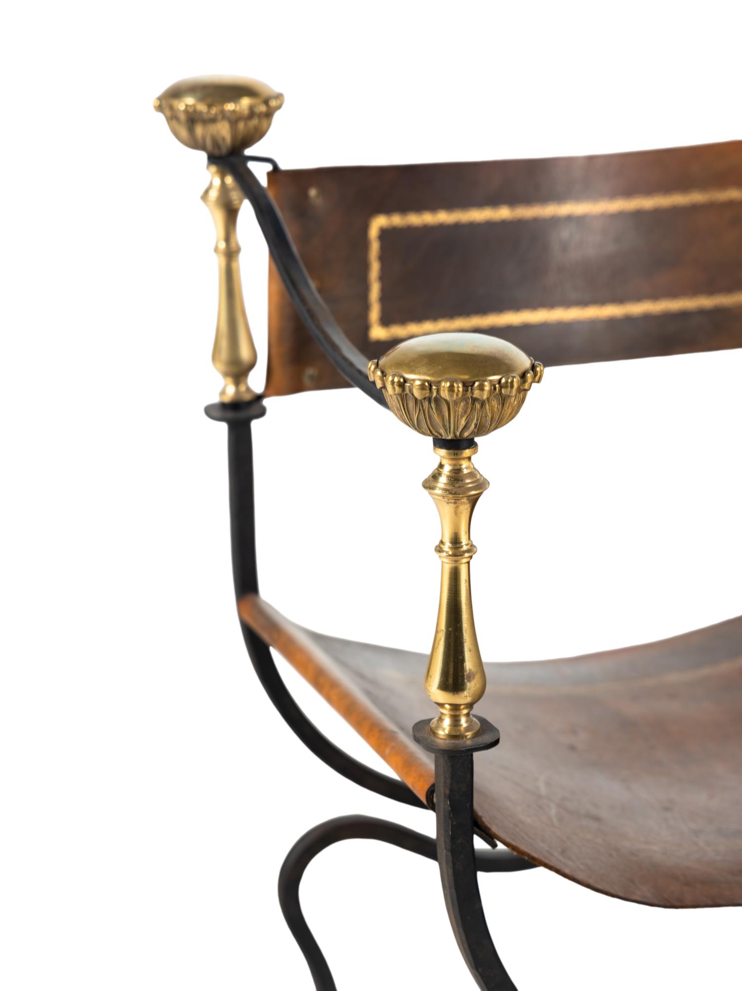 A Near Pair of Continental Iron and Brass Curule Armchairs