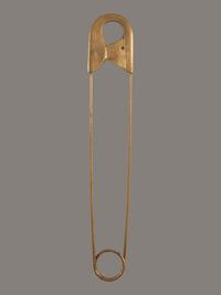 A Gold Painted Bronze Safety Pin Shop Sign