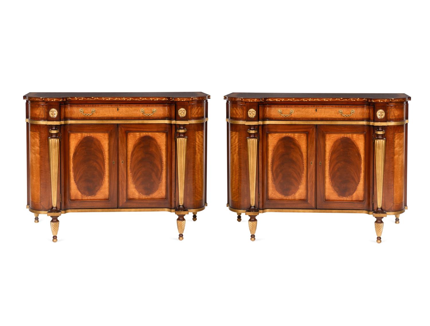 A Pair of E.J. Victor Regency Style Parcel Gilt Mahogany Sideboards
