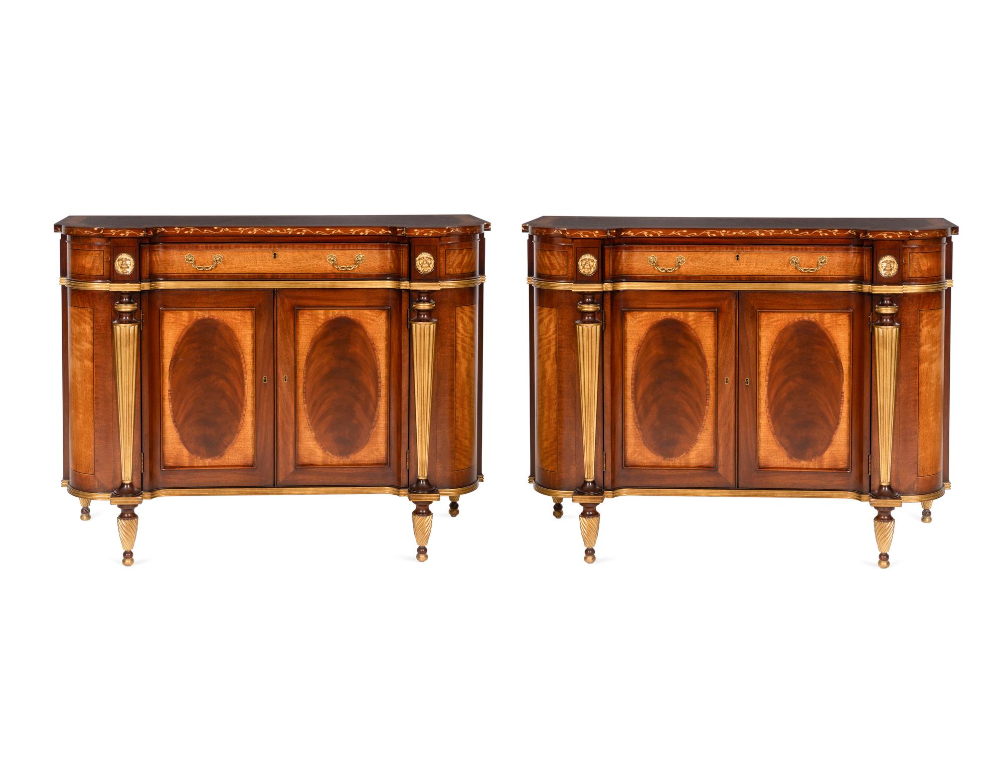 A Pair of E.J. Victor Regency Style Parcel Gilt Mahogany Sideboards