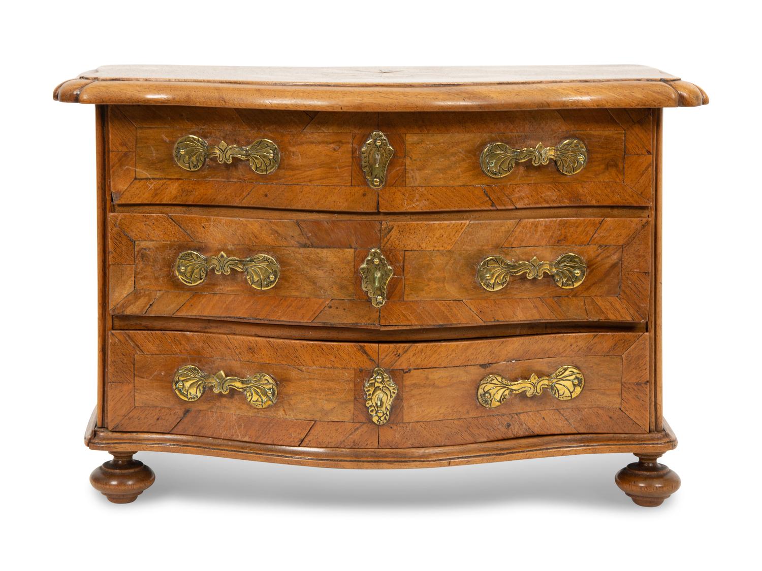 A French Walnut Marquetry Miniature Bow Front Commode