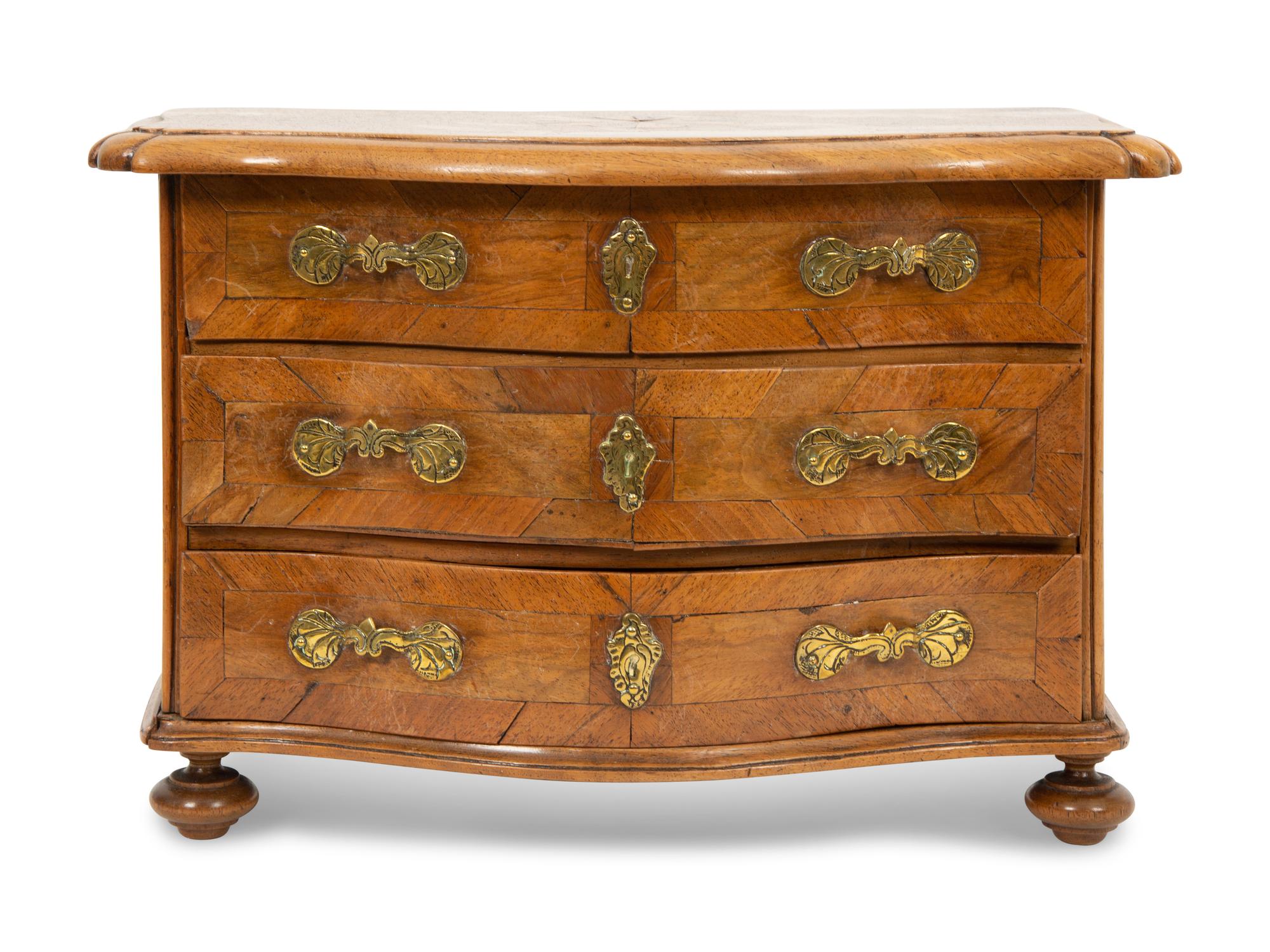 A French Walnut Marquetry Miniature Bow Front Commode