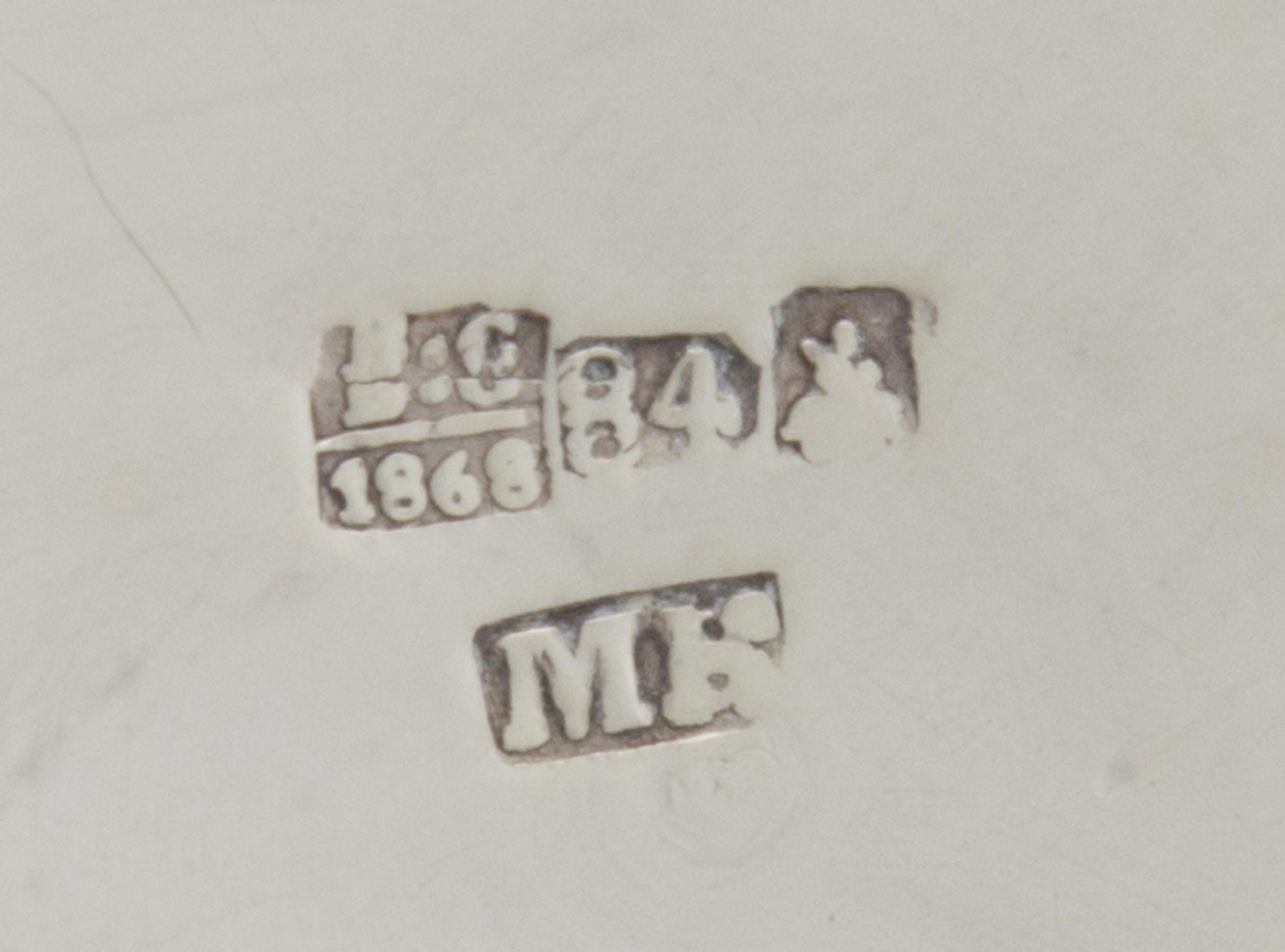 A Russian Silver Tankard, Mark of Michael Karpinsky, Assay of Viktor Savinsky, Moscow, 1868, the lid worked to show shaped panels enclo