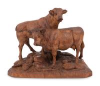 A Swiss Black Forest Carved Bull and Cow Group