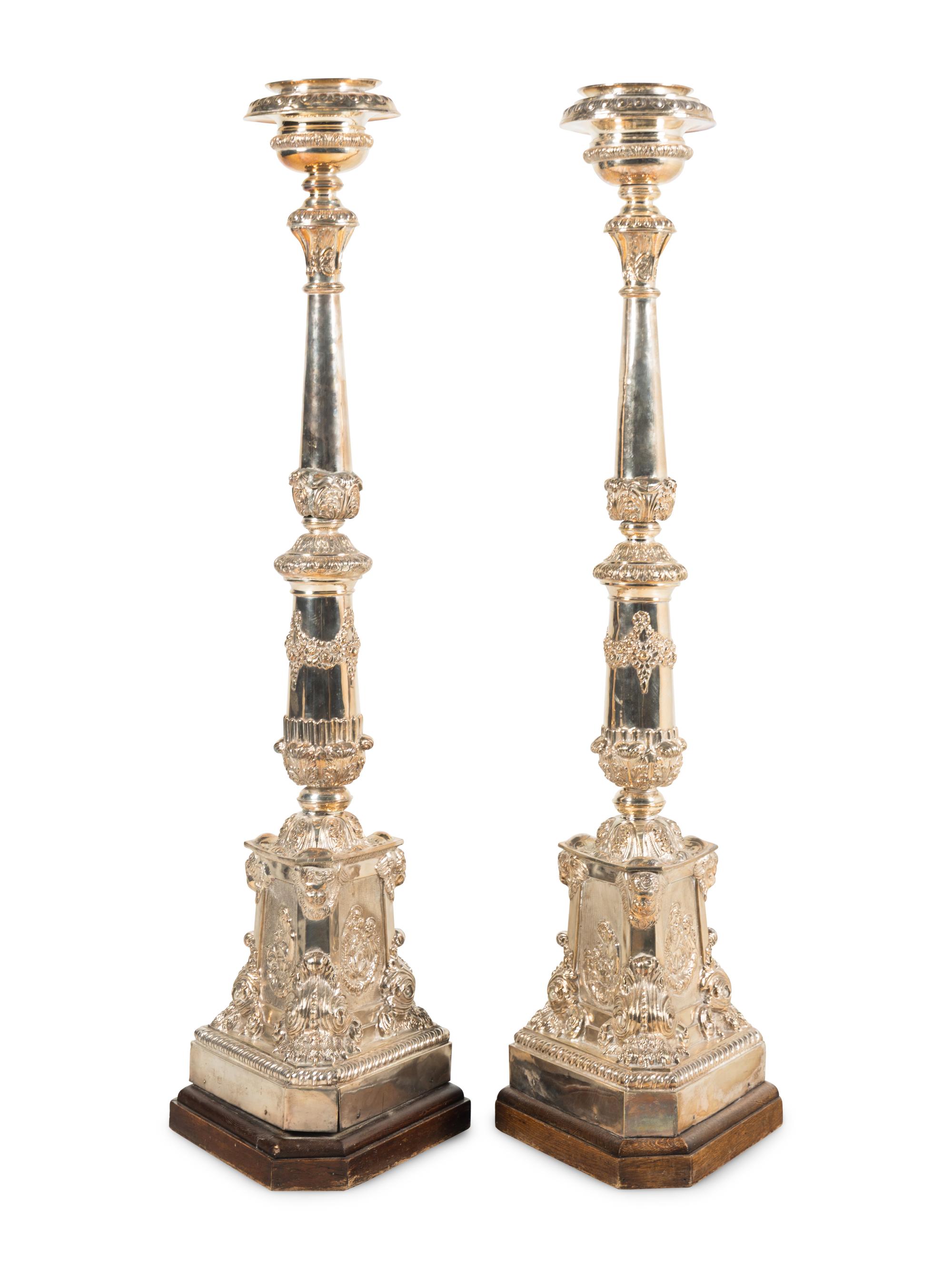 A Pair of Monumental Silvered Metal Altar Sticks