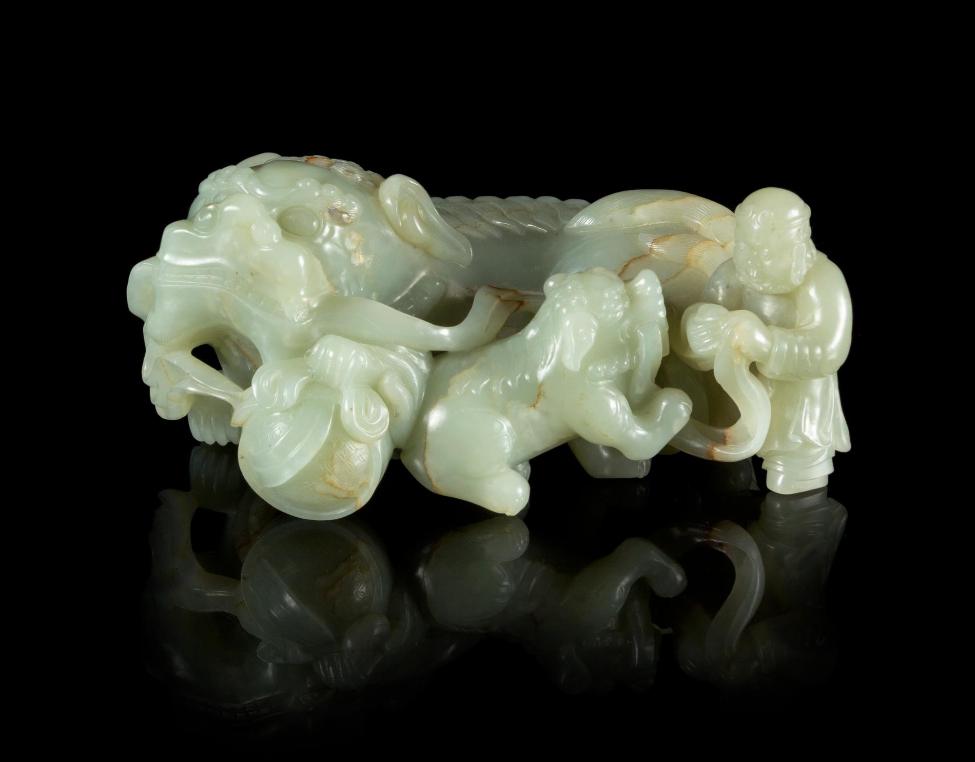 A Carved Celadon Jade Figural Group Length 7 1/2 inches.