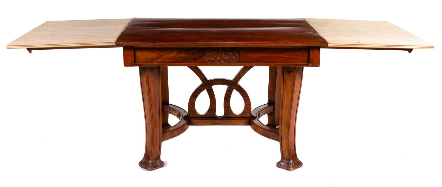 An Italian Art Nouveau Style Walnut Dining Suite Height of table 31 1/2 x width 47 1/2 (closed) x depth 40 1/4 inches. — 20TH CENTURY