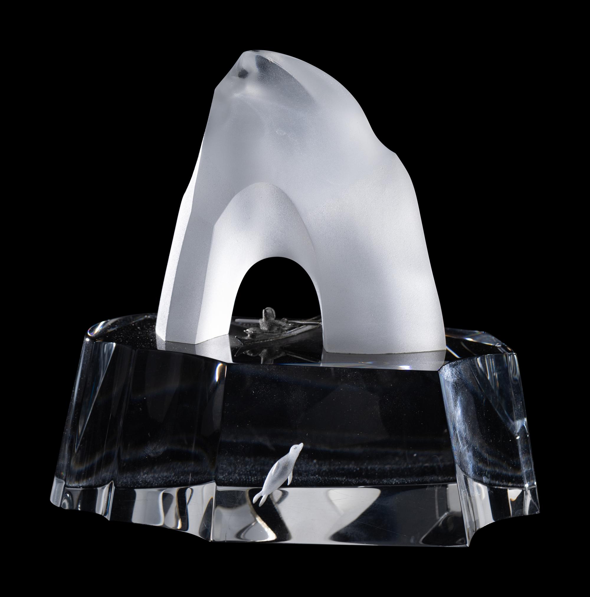 A Steuben Glass and Silver Ice Penguin Sculpture