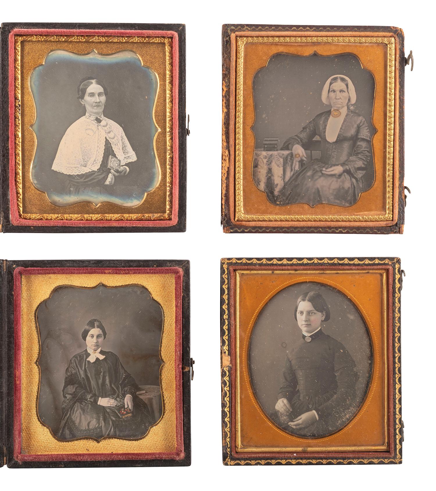 [EARLY PHOTOGRAPHY]. A group of 23 daguerreotypes featuring subjects posed with cased images, including: