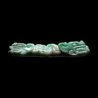 A Maya Jade Serpent Pendant