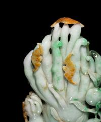 A Chinese Apple Green and Russet Jadeite Carving of Buddha's Hand Citron