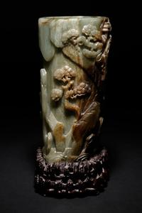 A Carved Celadon and Russet Jade Brush Pot and Stand, Bitong