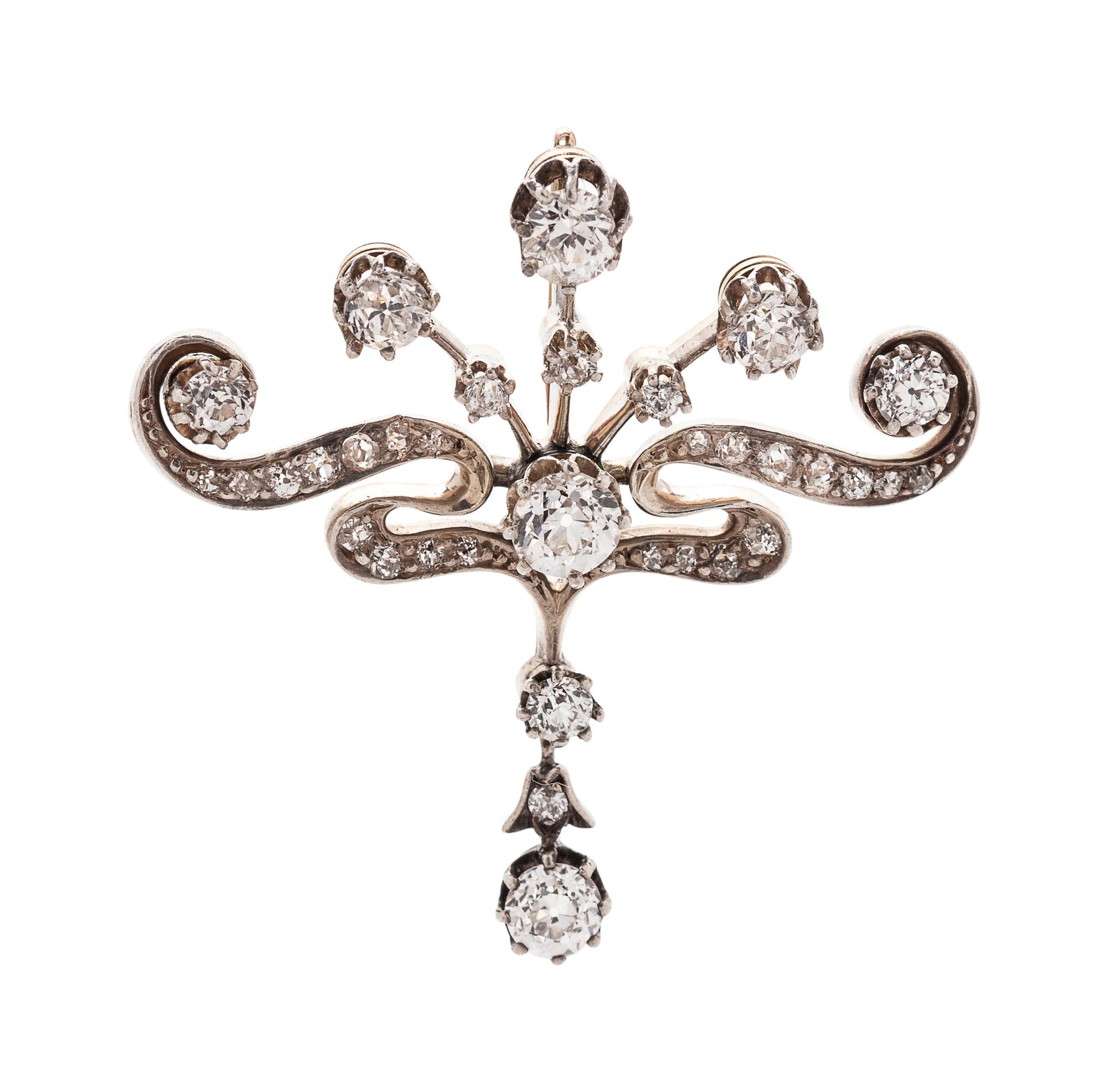 A Silver Topped 18 Karat Rose Gold and Diamond Pendant,