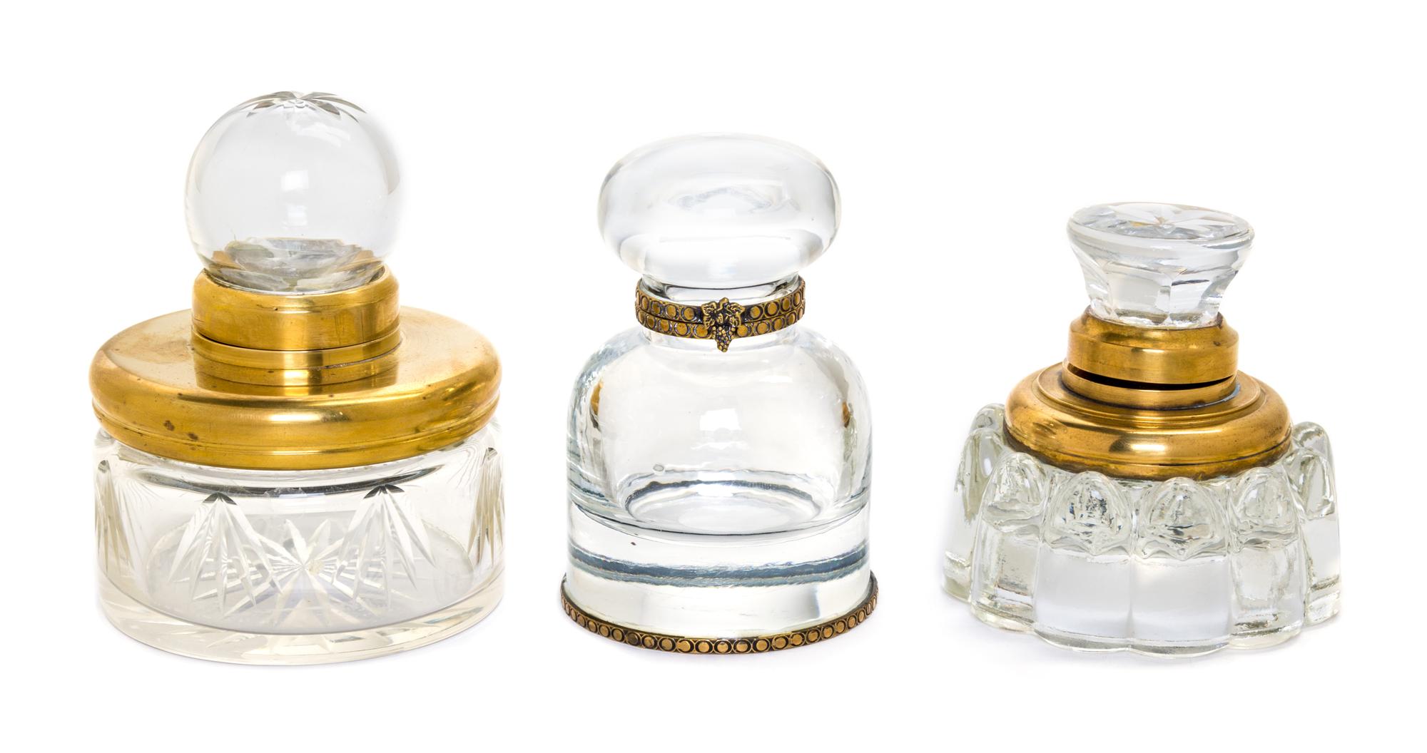 Three Brass Mounted Glass Inkwells Height of tallest 3 3/4 inches.