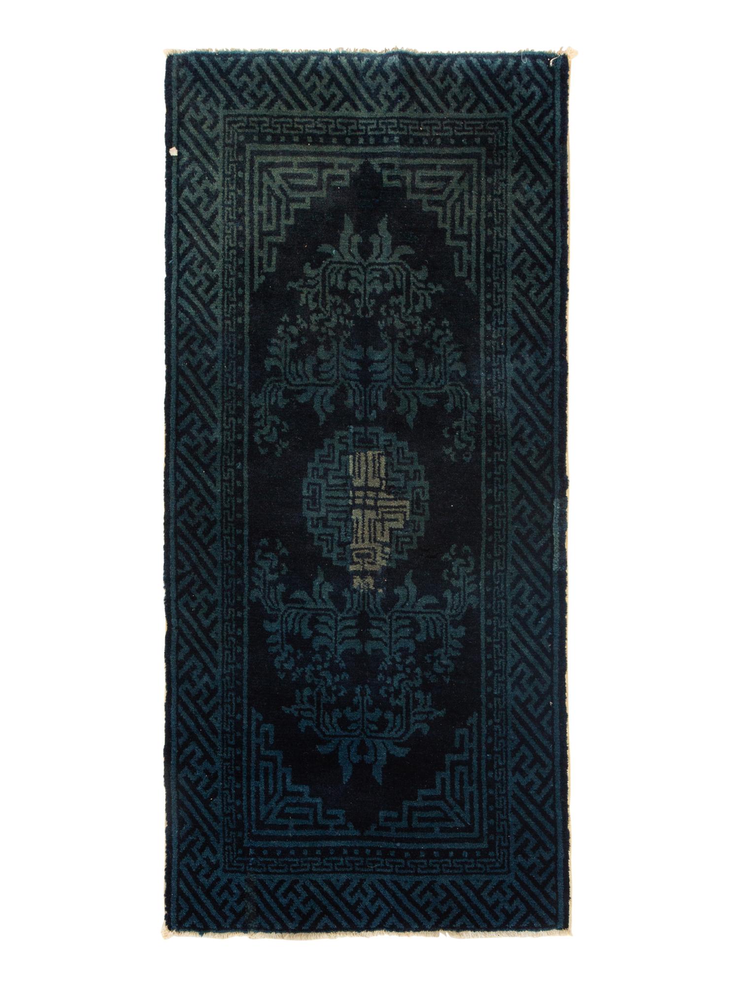 A Group of Four Chinese Rugs