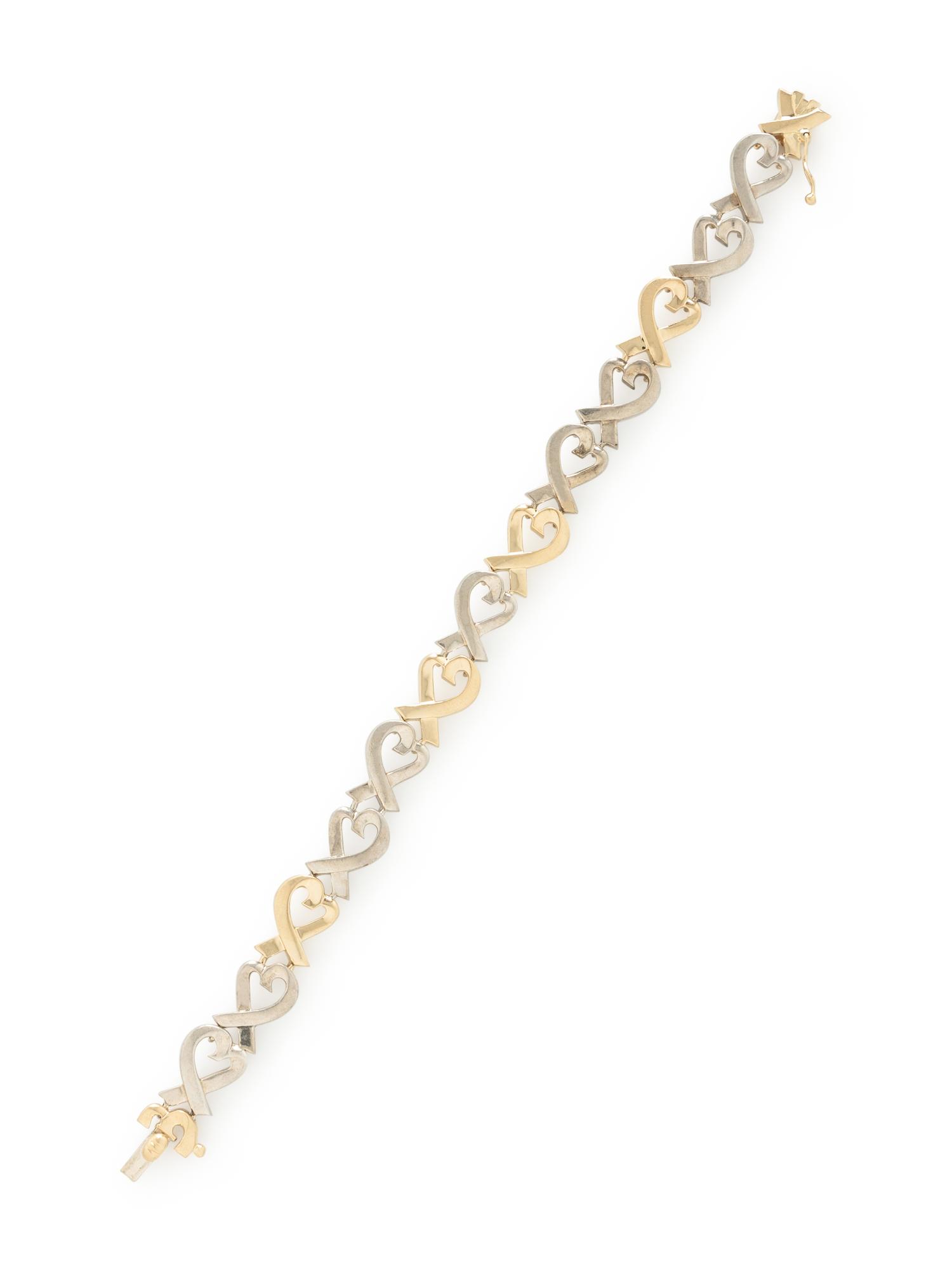 TIFFANY & CO., PALOMA PICASSO, STERLING SILVER AND YELLOW GOLD 'LOVING HEART' BRACELET