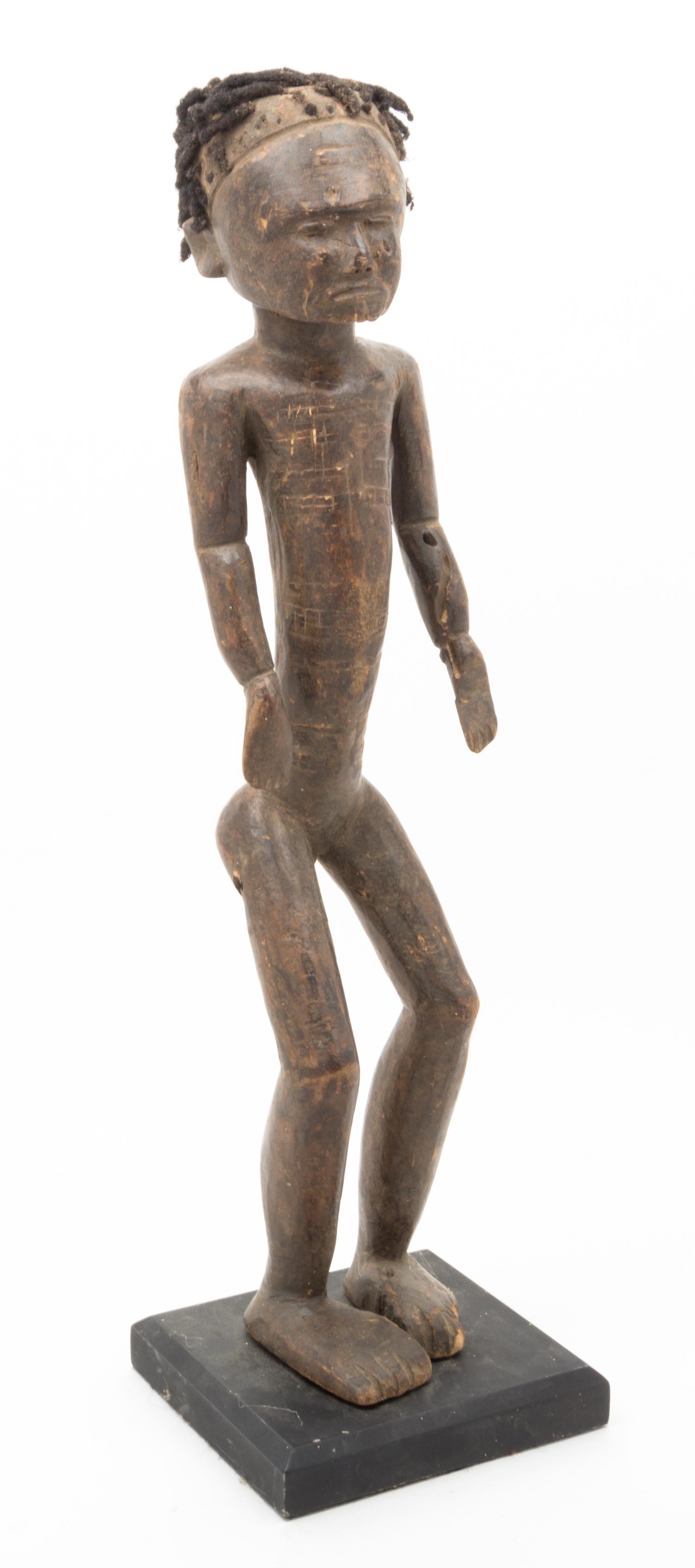 A Carved Ethnographic Figure Height 23 inches.