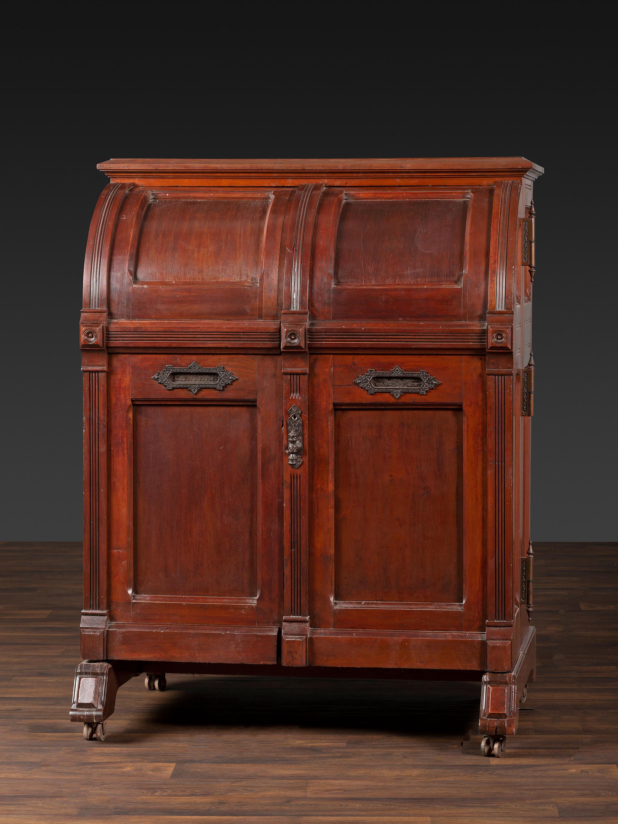 A Carved Walnut Wooton Secretary Desk