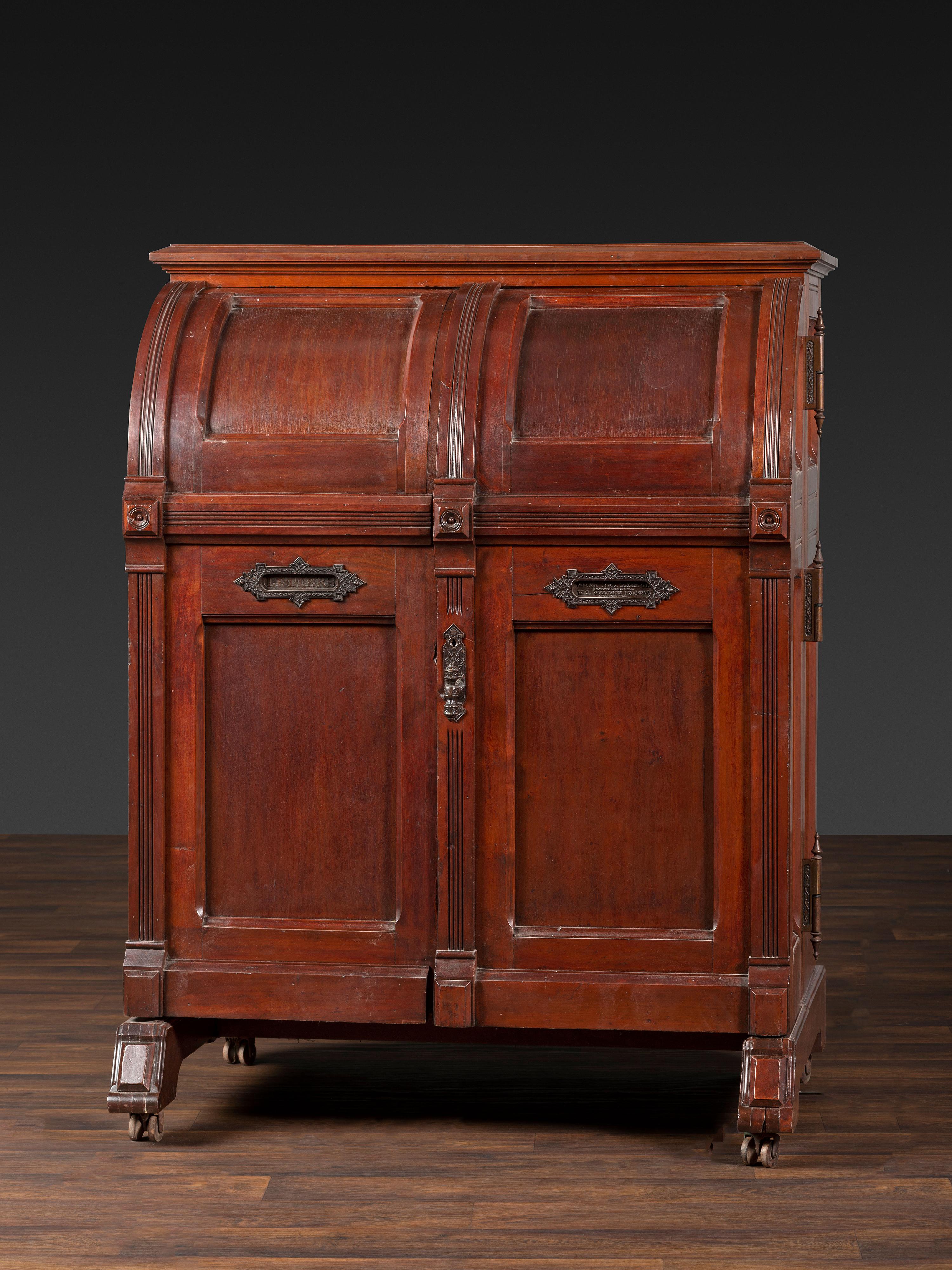 A Carved Walnut Wooton Secretary Desk