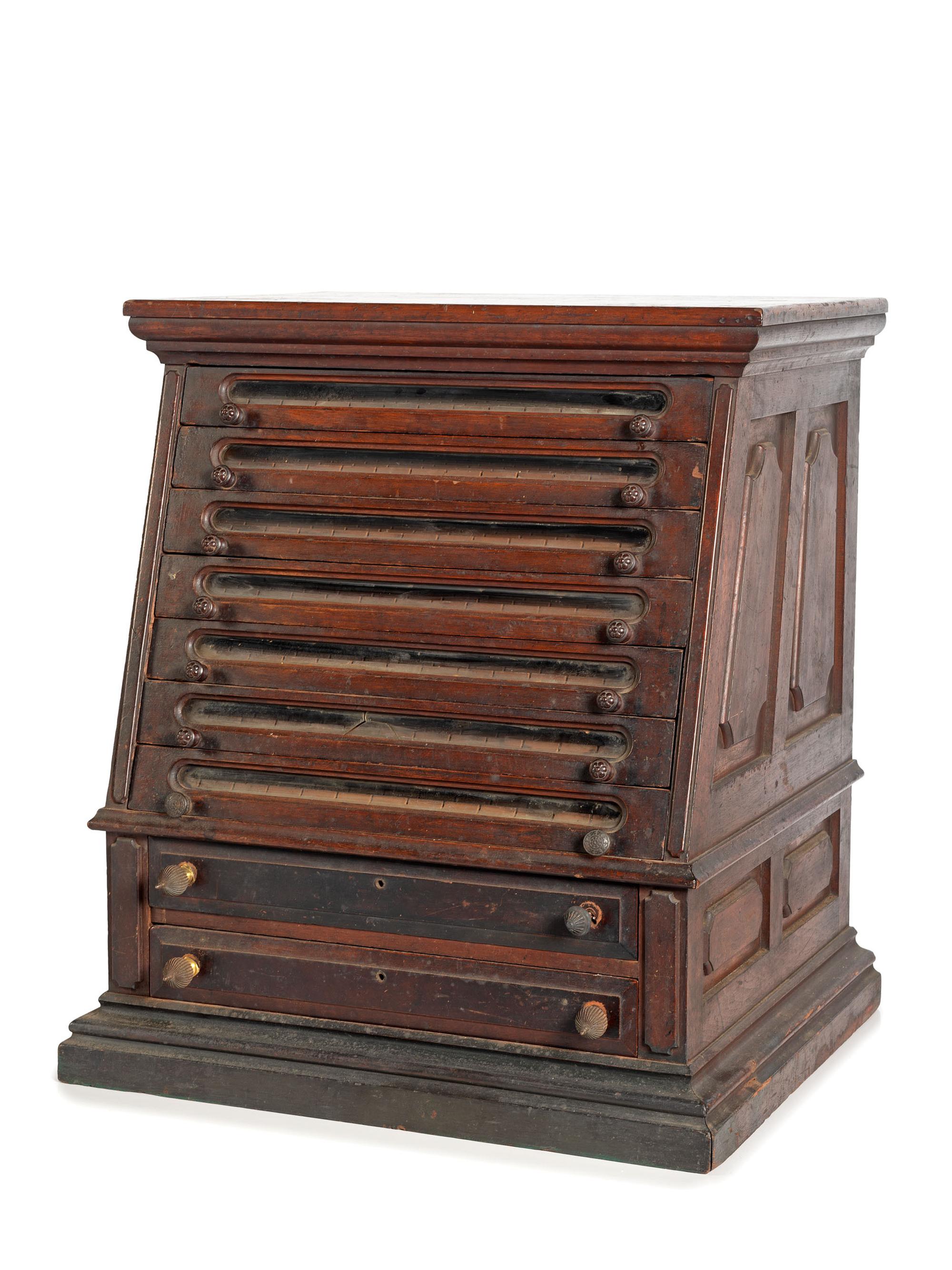A Nine Drawer Counter Top Spool Cabinet