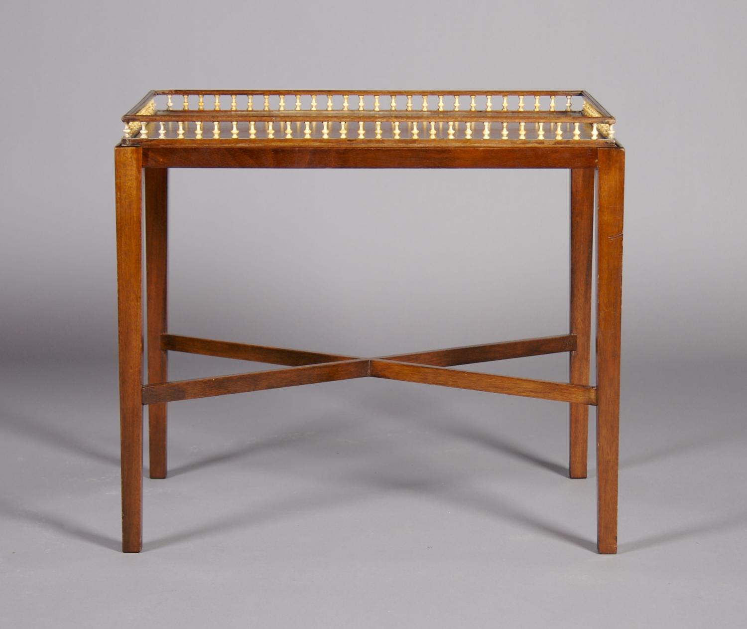 An English Mahogany Serving Tray on Stand, Height 21 x width 23 3/4 x depth 16 inches.
