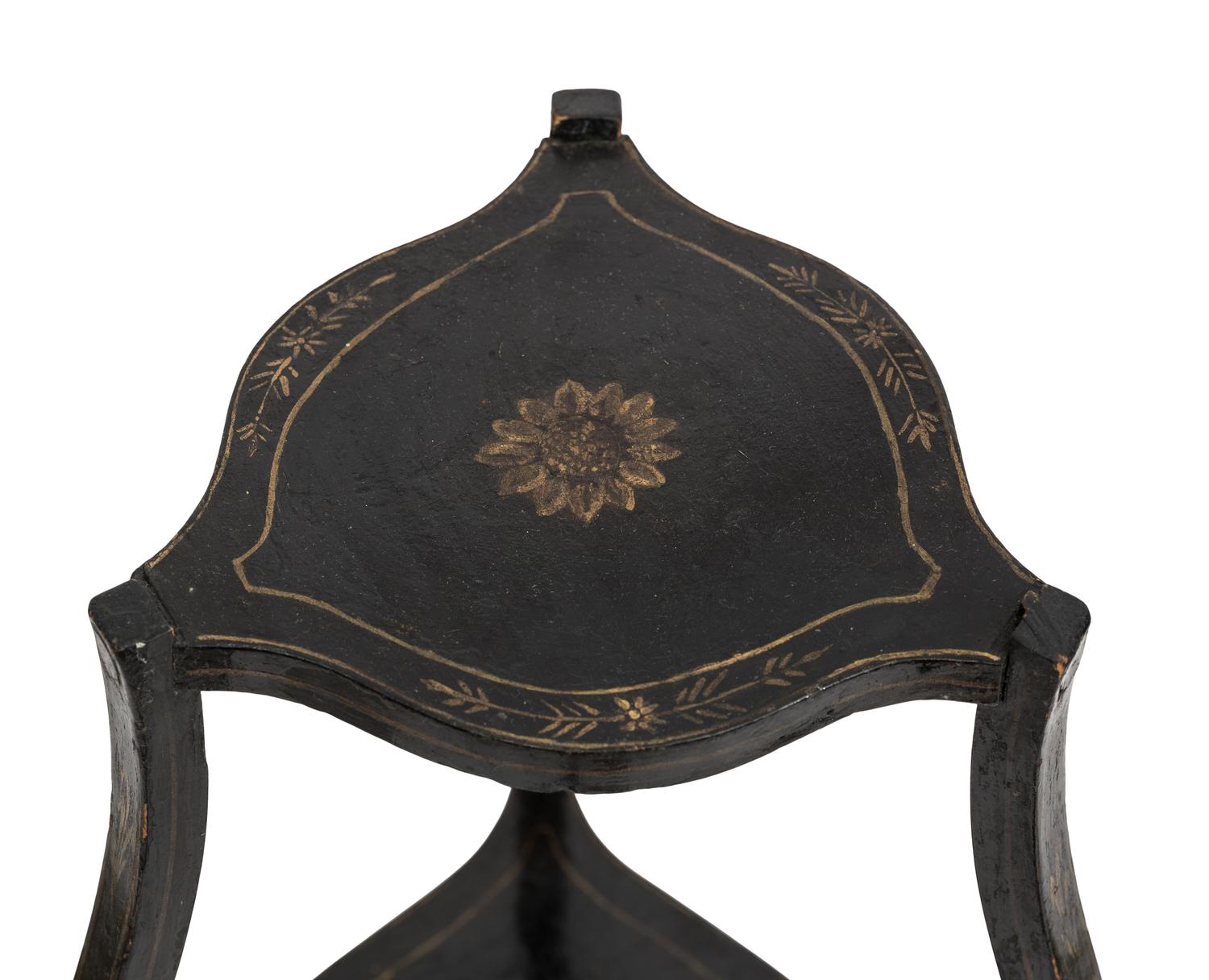 A Continental Style Black-Painted and Parcel Gilt Bombe Tripod Stand
