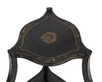 A Continental Style Black-Painted and Parcel Gilt Bombe Tripod Stand
