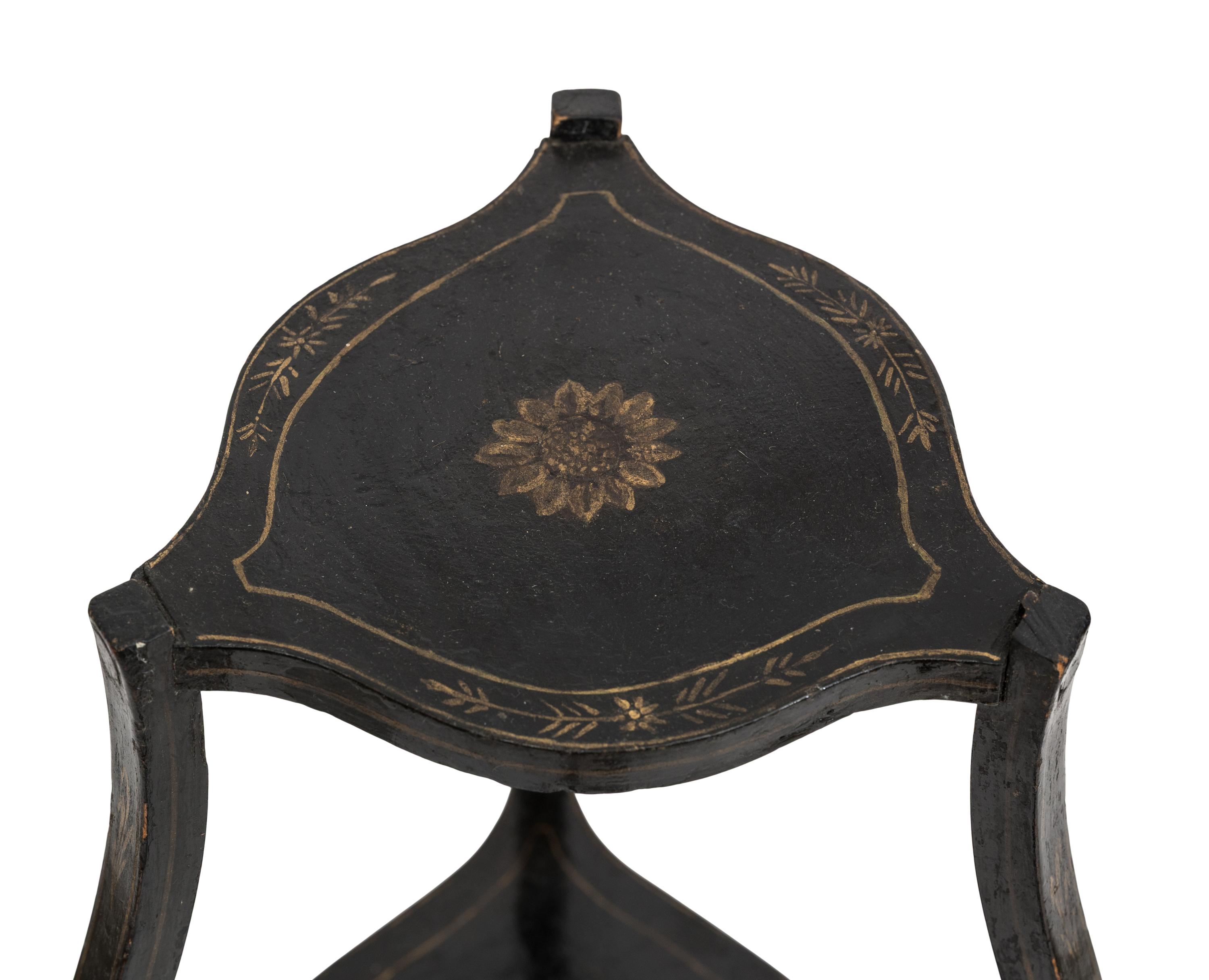 A Continental Style Black-Painted and Parcel Gilt Bombe Tripod Stand