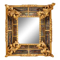 A Flemish Ebonized, Parcel Gilt and Reverse Painted Mirror