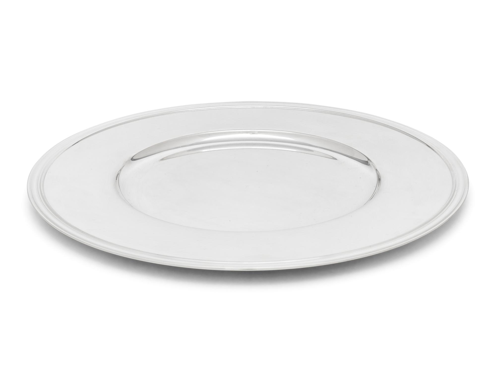 A Set of Thirteen Christofle Silver-Plate Chargers