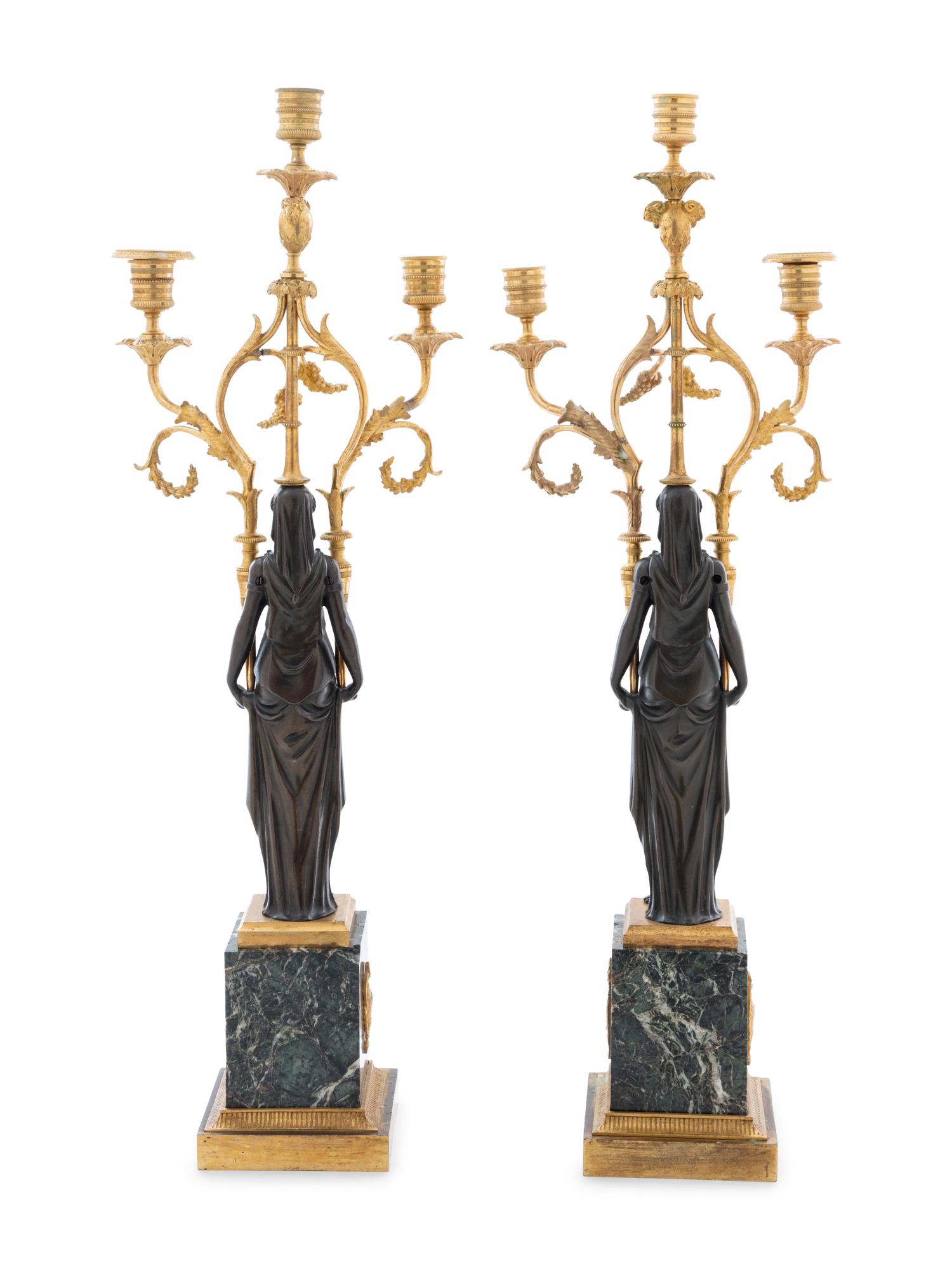 A Pair of Empire Gilt and Patinated Bronze and Marble Three-Light Figural Candelabra