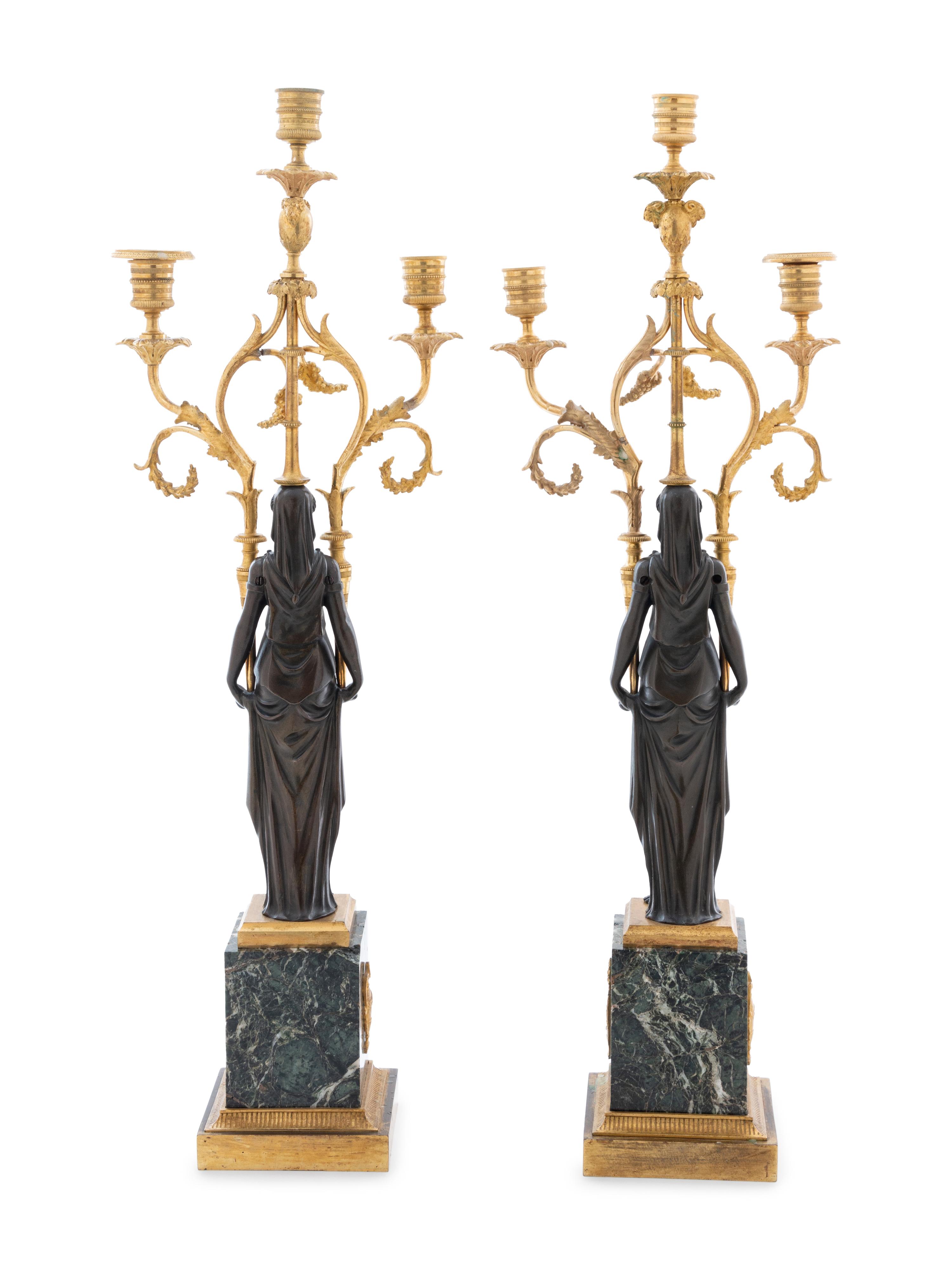 A Pair of Empire Gilt and Patinated Bronze and Marble Three-Light Figural Candelabra