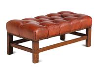 A Pair of Leather Wingback Armchairs with Ottoman