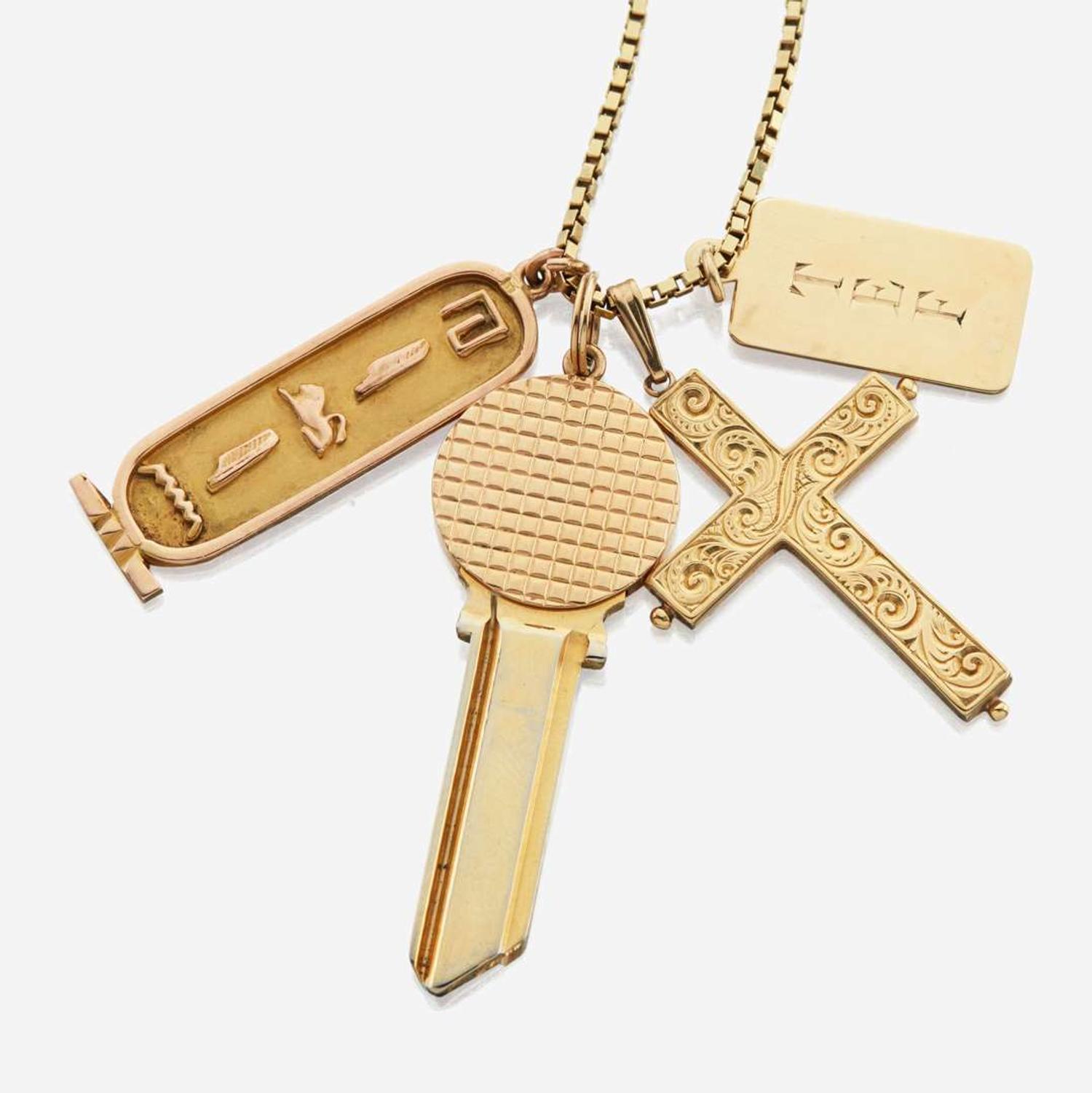 A collection of four gold necklaces