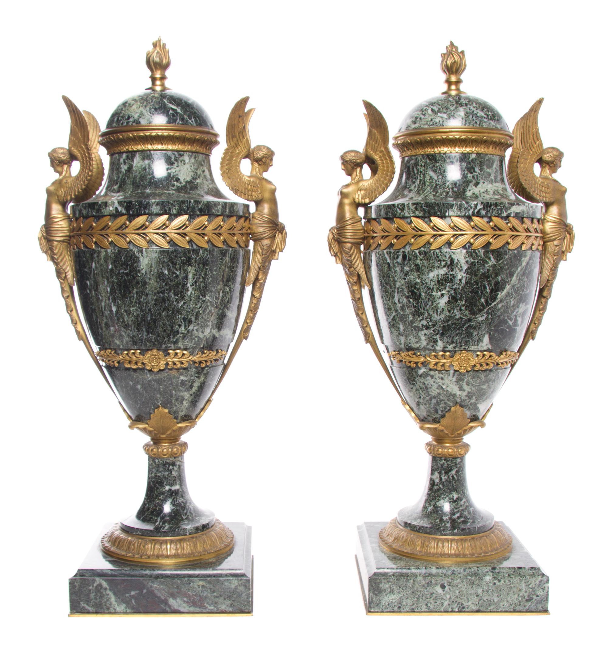 A Pair of Neoclassical Gilt Bronze Mounted Marble Urns Height 22 1/2 inches.