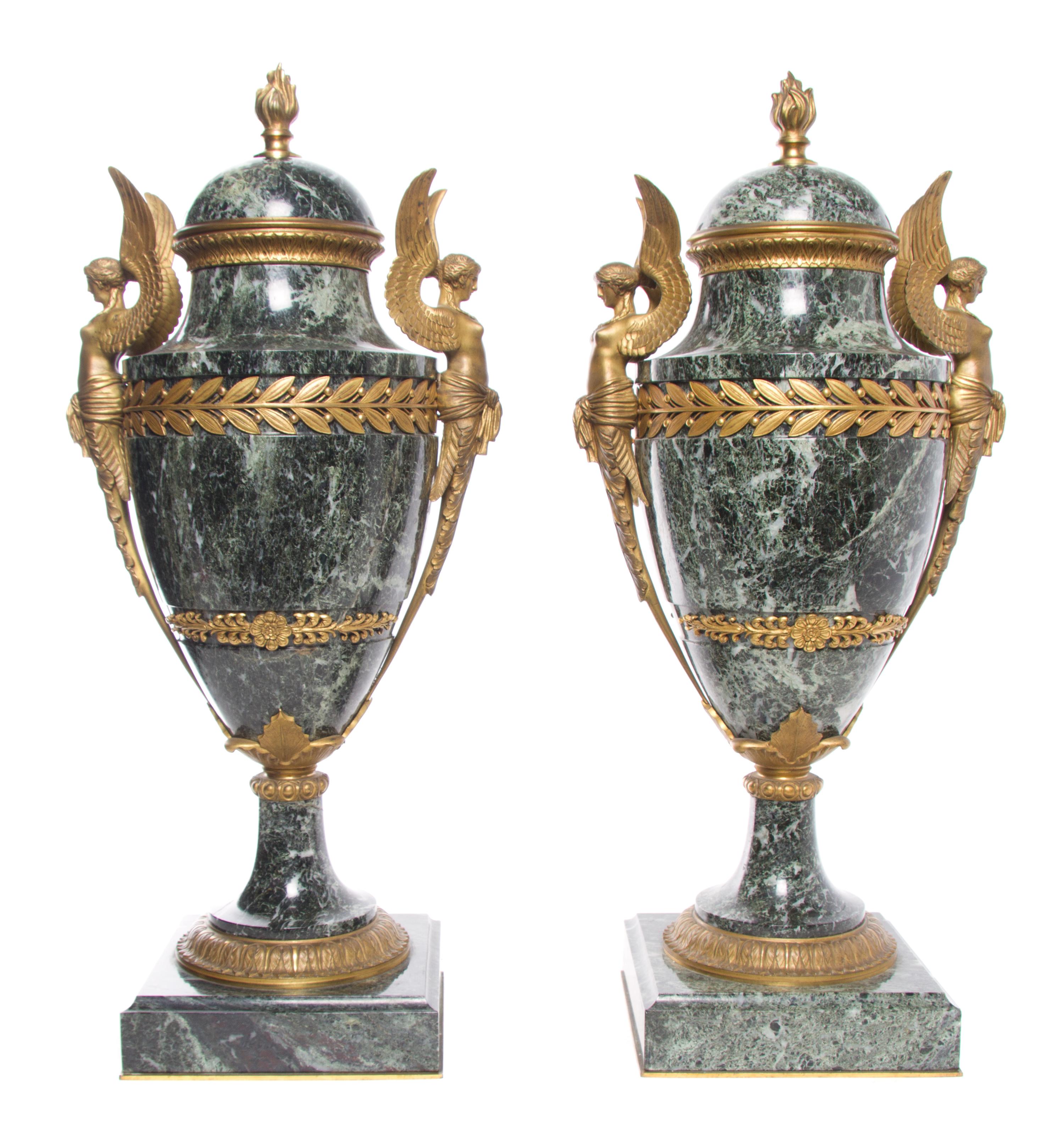 A Pair of Neoclassical Gilt Bronze Mounted Marble Urns Height 22 1/2 inches.